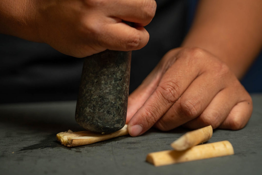 Smash burdock root (using a pestle)