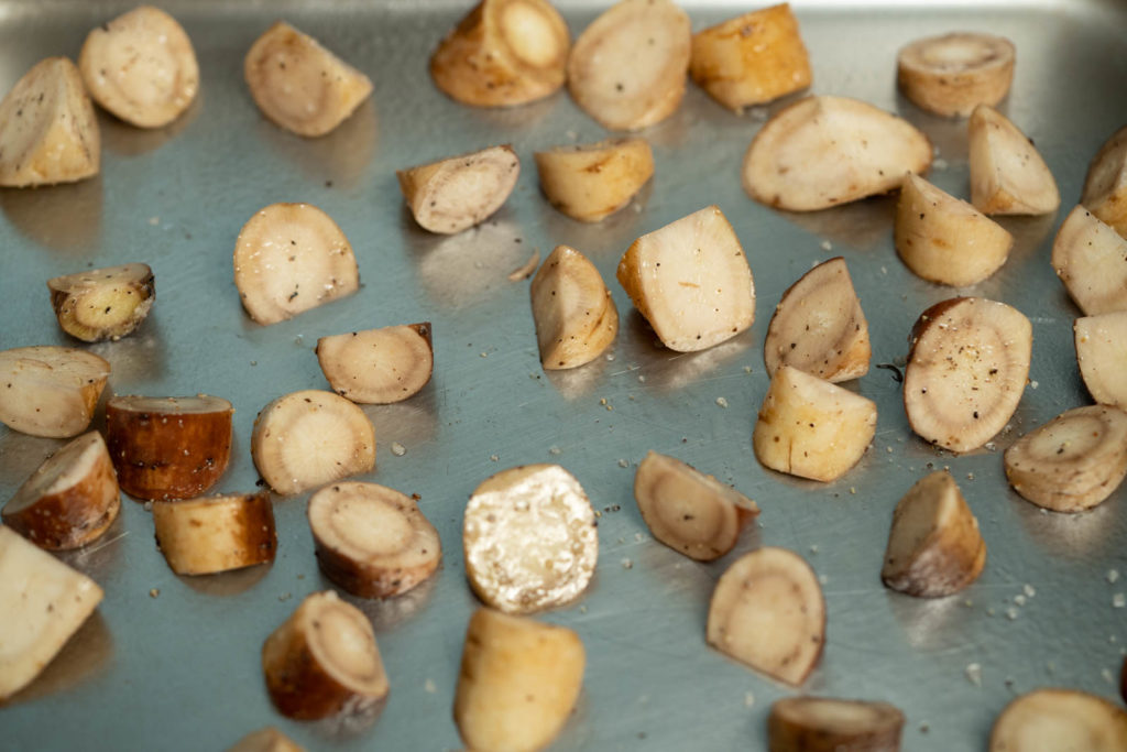 Spread seasoned gobo onto a greased sheet pan