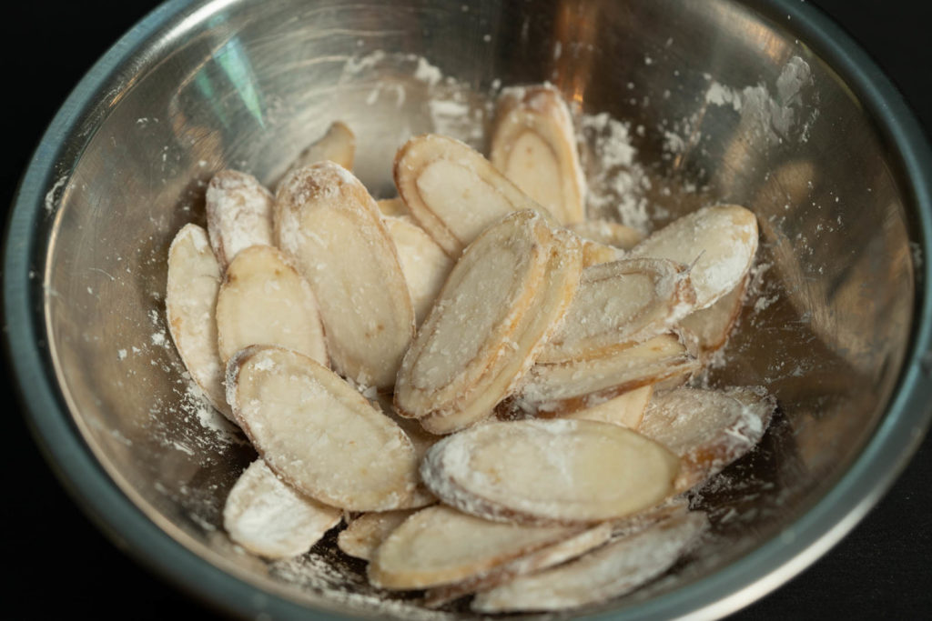 Season slices with cornstarch and salt