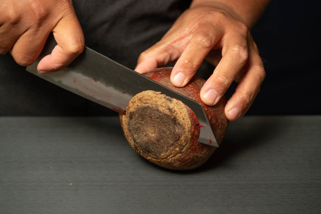 Cut off top and bottom ends of beets