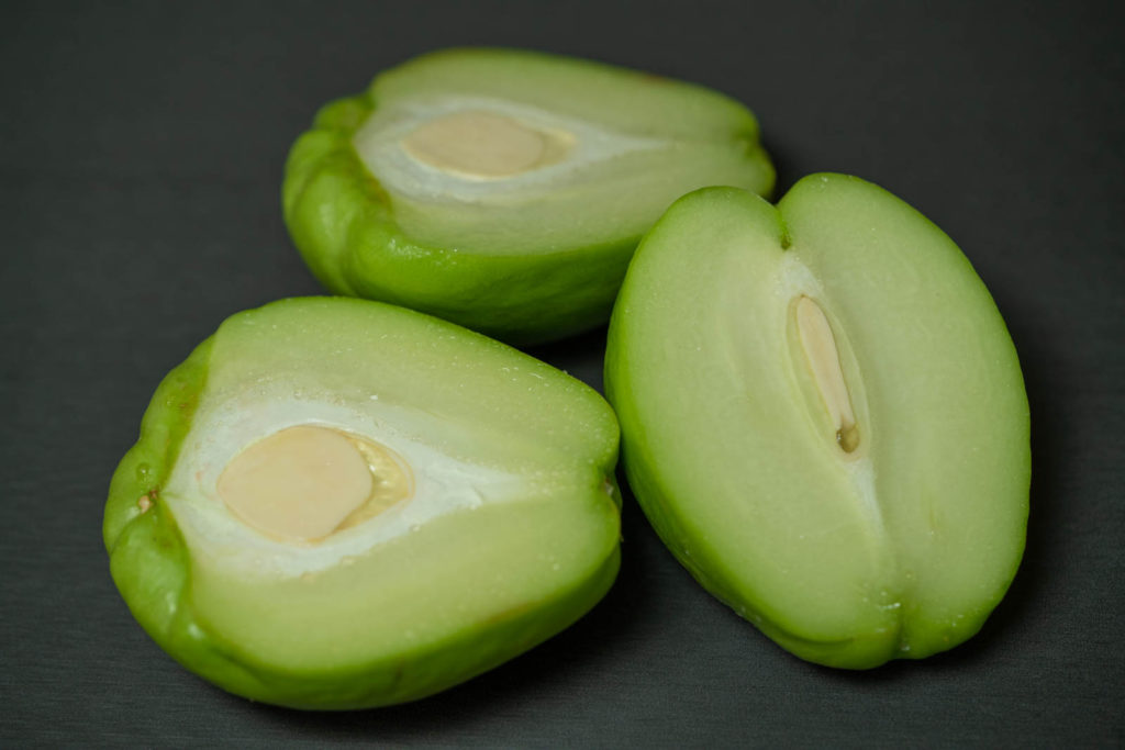 Cut chayote in half lengthwise
