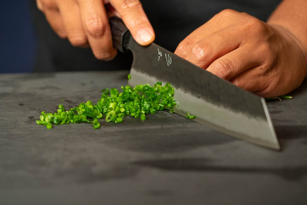 Slice green onions thinly
