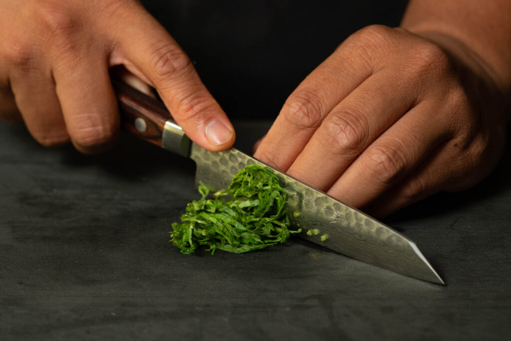 Chiffonade or slice basil