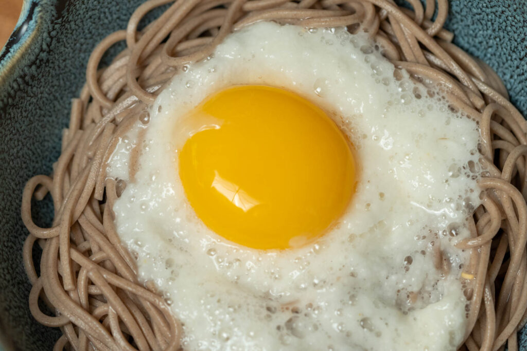 Place egg yolk on top of tororo