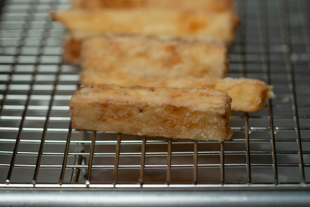 Drain excess oil off nagaimo fries