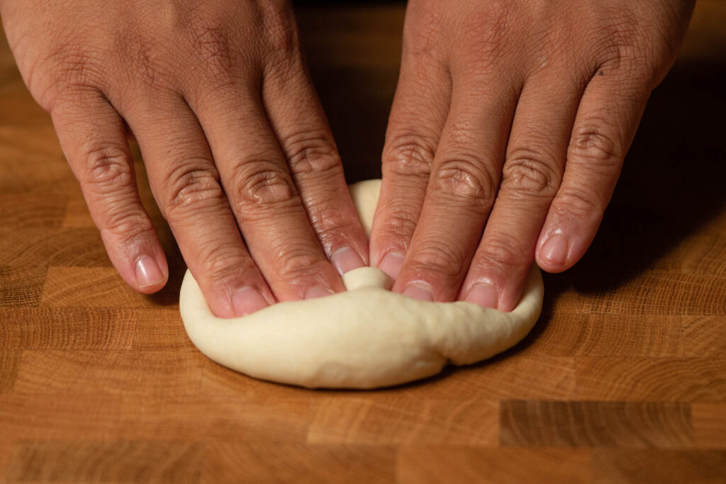 Press out dough balls with fingers first