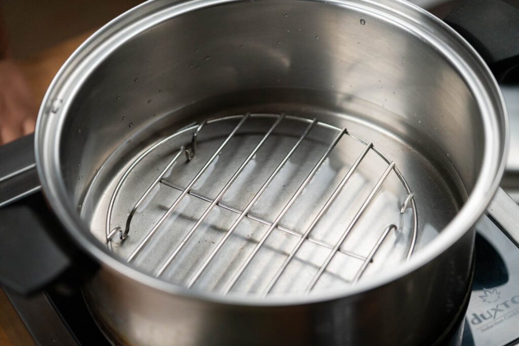 Steamer rack in a pot with water