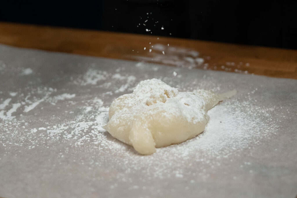 cooked mochi on starched parchment