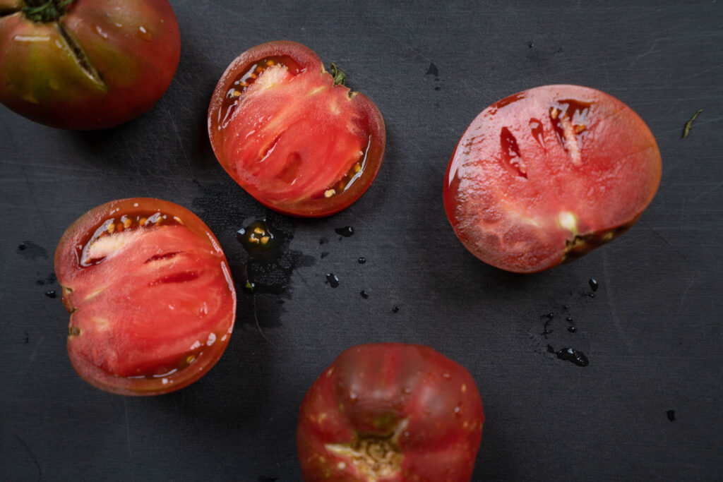 Sliced open red heirloom tomato