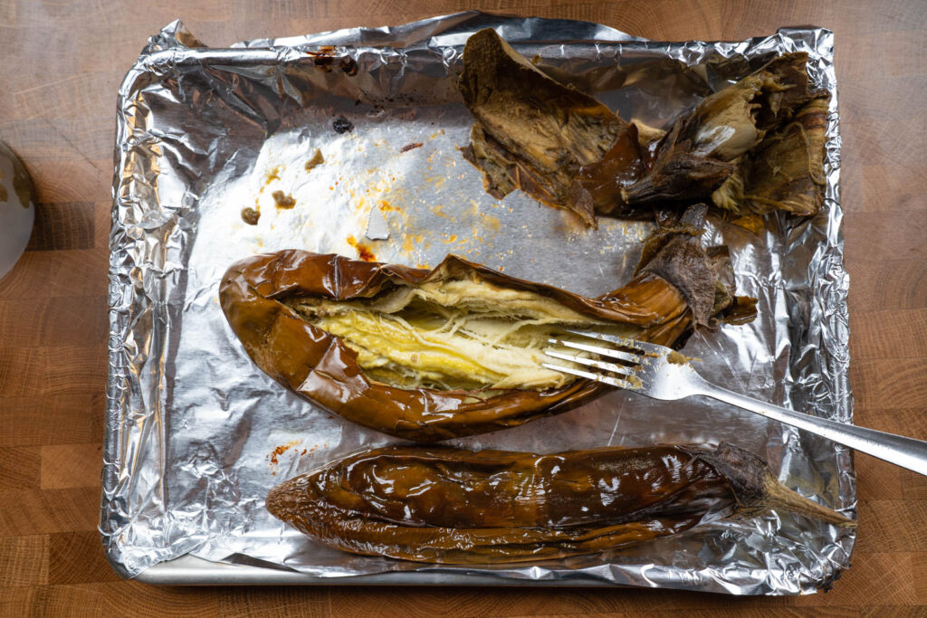 Baigan Bhartha: Roast and peel eggplants