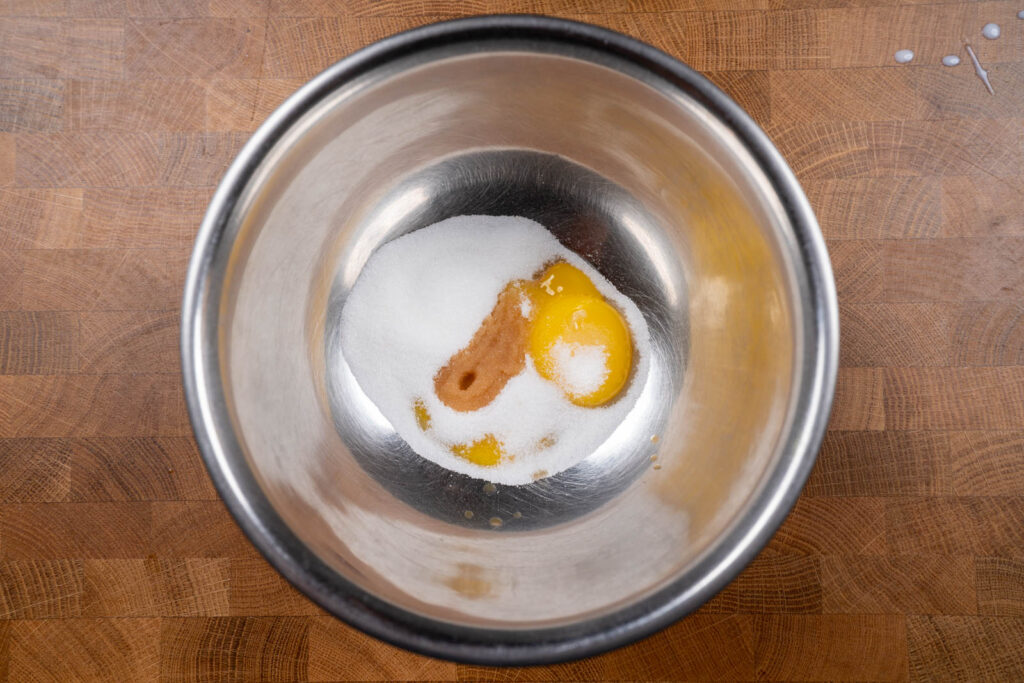 Separate bowl: combine sugar, egg yolks, and vanilla