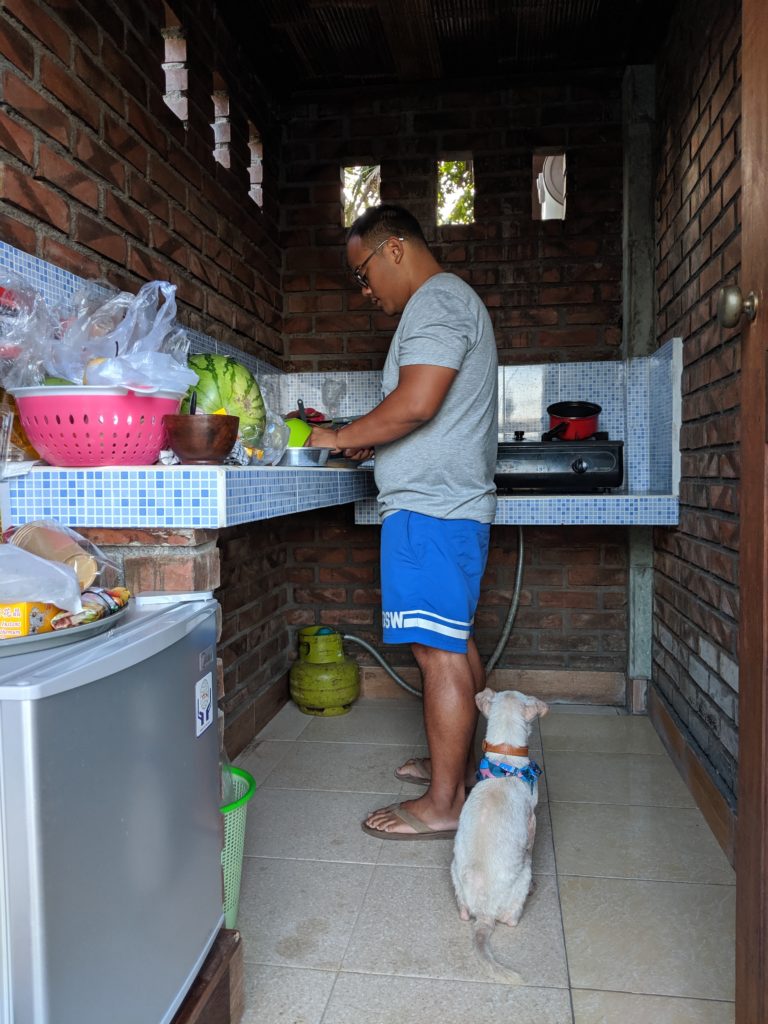 Carl cooking Kacang's food in Bali, Indonesia