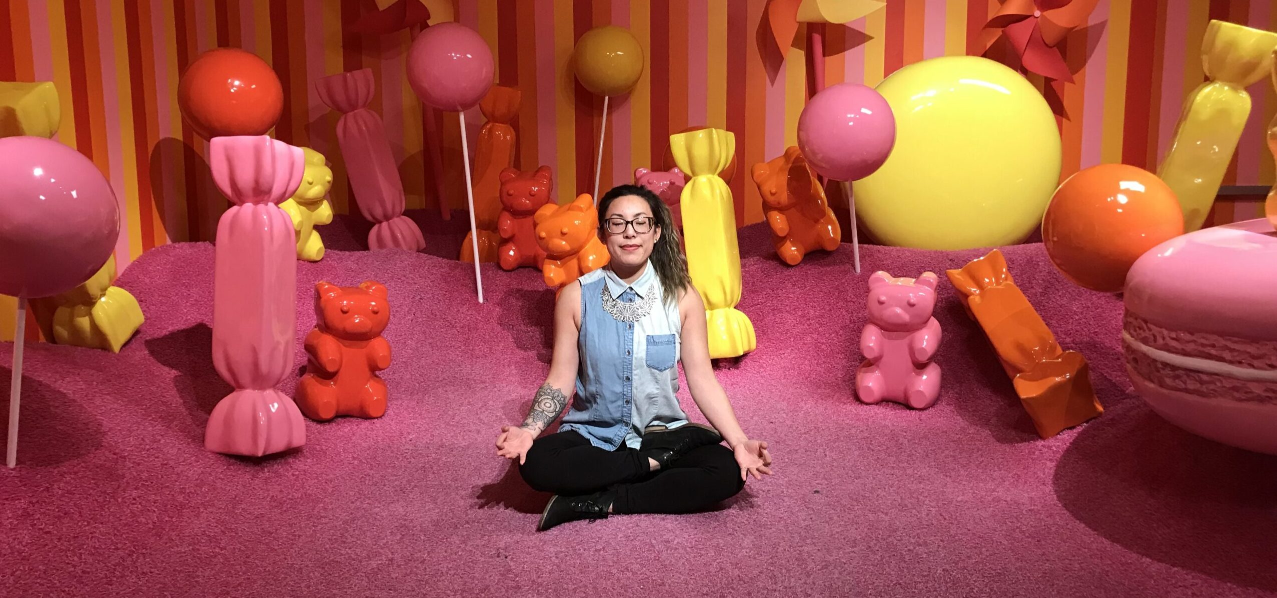 Adrienne meditating at Museum of Ice Cream